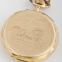Antique gold pocket watch on watch chain