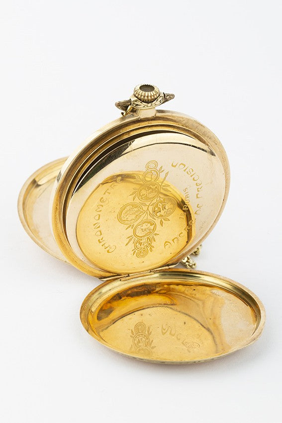 Gold savonette on gold watch chain