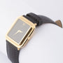 Gold Ebel watch on leather strap