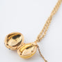 Yellow gold egg with brilliants on a yellow gold anchor chain, Fabergé