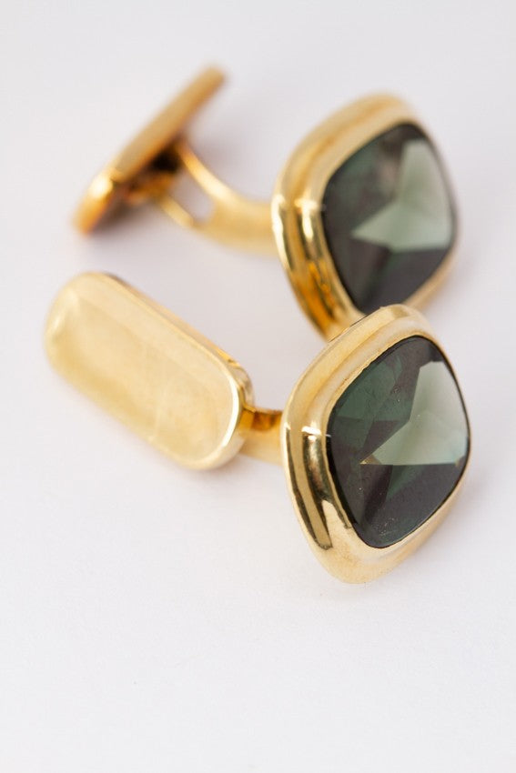 Gold cufflinks, each with a tourmaline