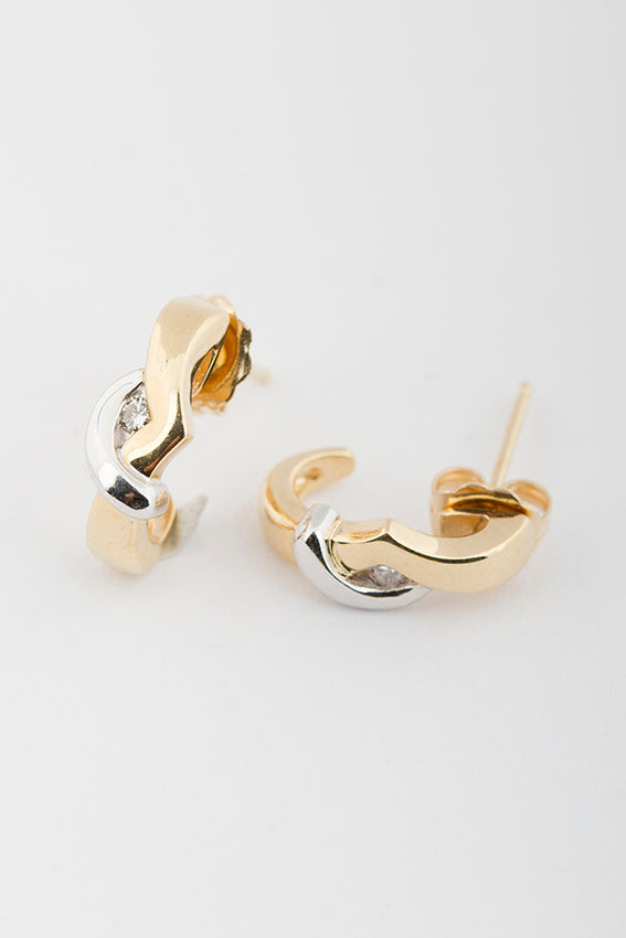 White/yellow gold stud earrings with brilliant cut diamonds