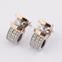 White/yellow gold stud earrings with brilliant cut diamonds