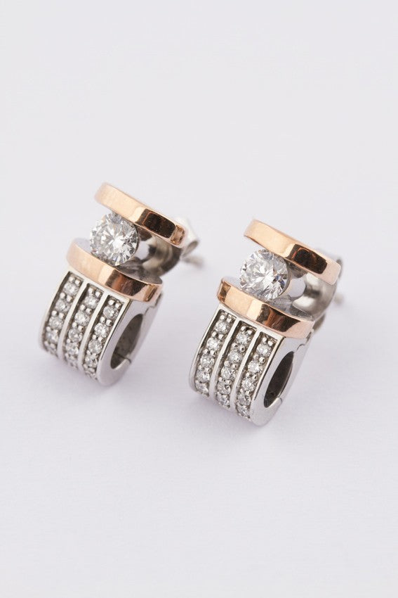 White/yellow gold stud earrings with brilliant cut diamonds