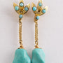 Gouden oorhangers met turkoois