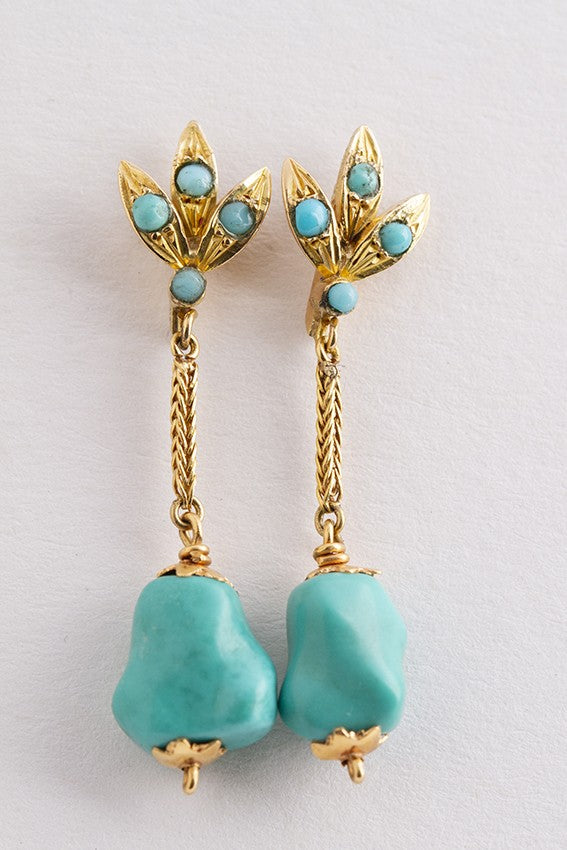 Gouden oorhangers met turkoois