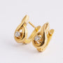 20 carat gold earrings, each with a brilliant
