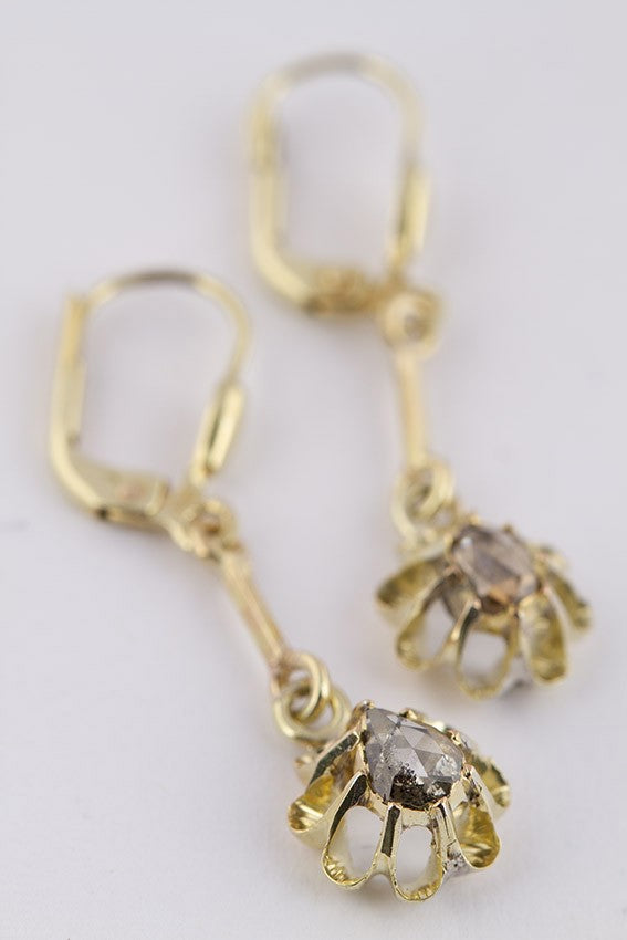 Gold earrings with a diamond in each one
