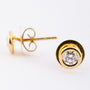 Gold solitaire earrings with brilliant