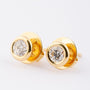Gold solitaire earrings with brilliant