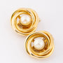 Gold clip-on earrings with pearl