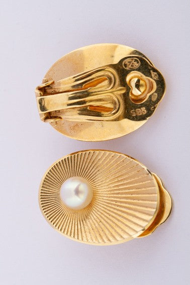 Gold clip-on earrings with cultured pearls
