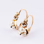 Antique gold earrings with pearl.