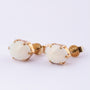 Earrings with a milk opal.