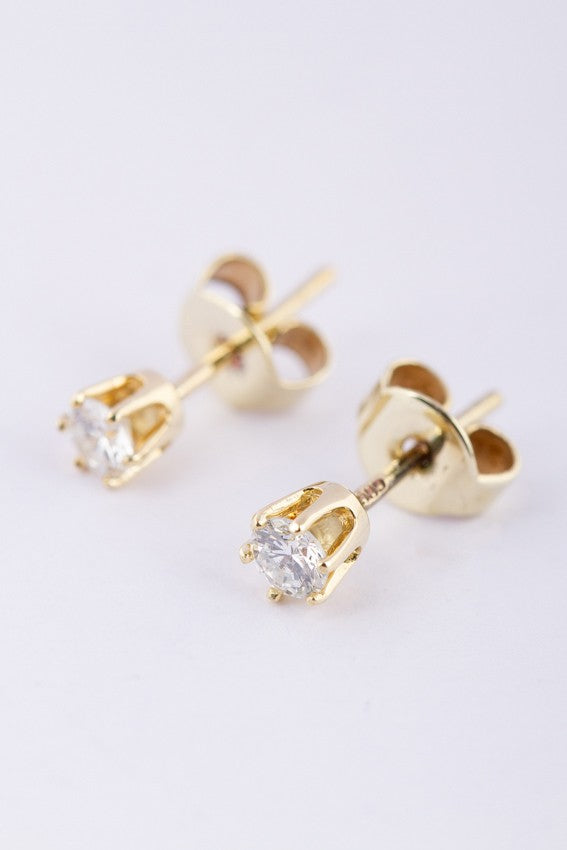 Gouden solitair oorknoppen met briljant