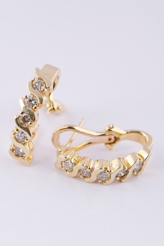 Gold stud earrings with 5 diamonds each