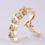 Gold stud earrings with 5 diamonds each
