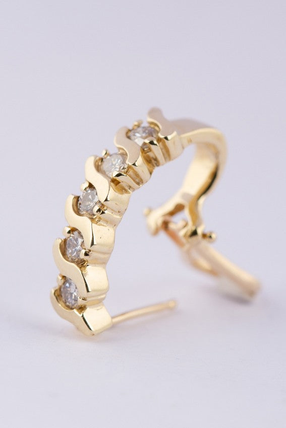 Gold stud earrings with 5 diamonds each
