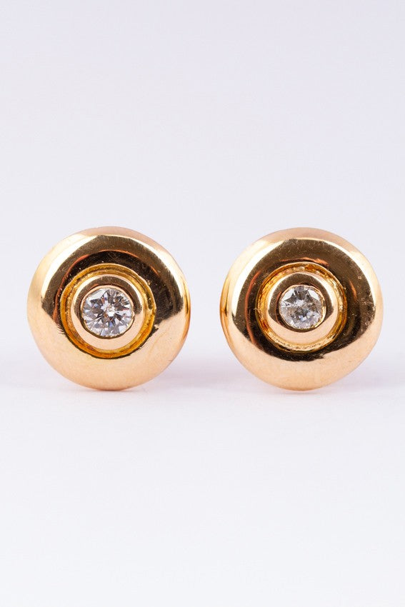 Solid gold earrings with a brilliant in each one