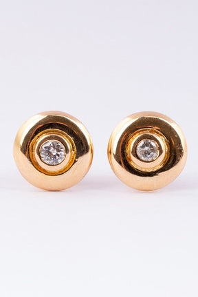 Solid gold earrings with a brilliant in each one