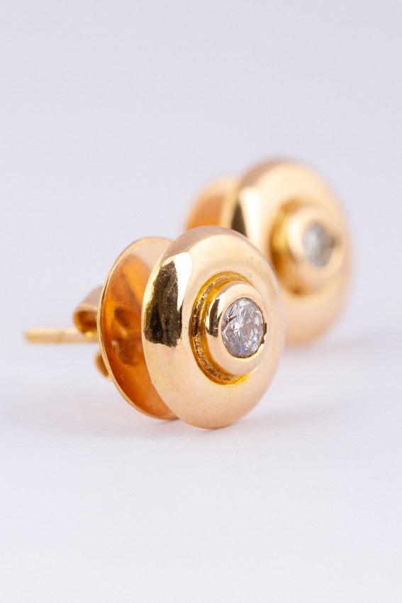Solid gold earrings with a brilliant in each one