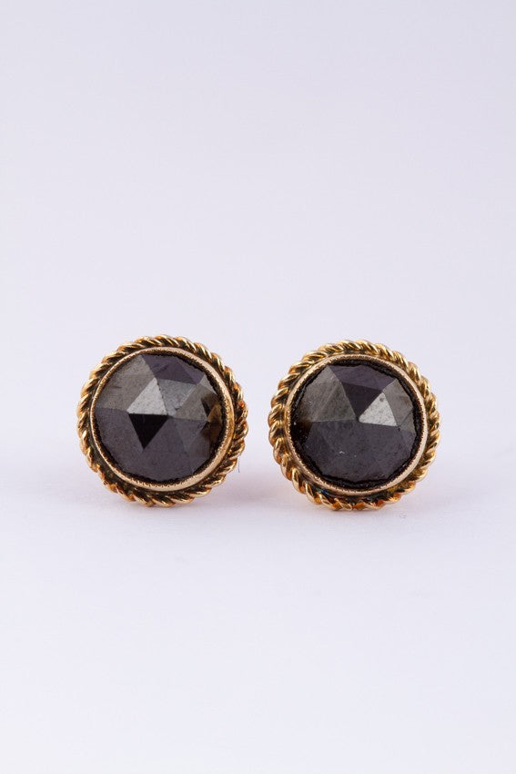 Gold earrings, each with a garnet