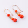 Gouden oorhangers met bloedkoraal