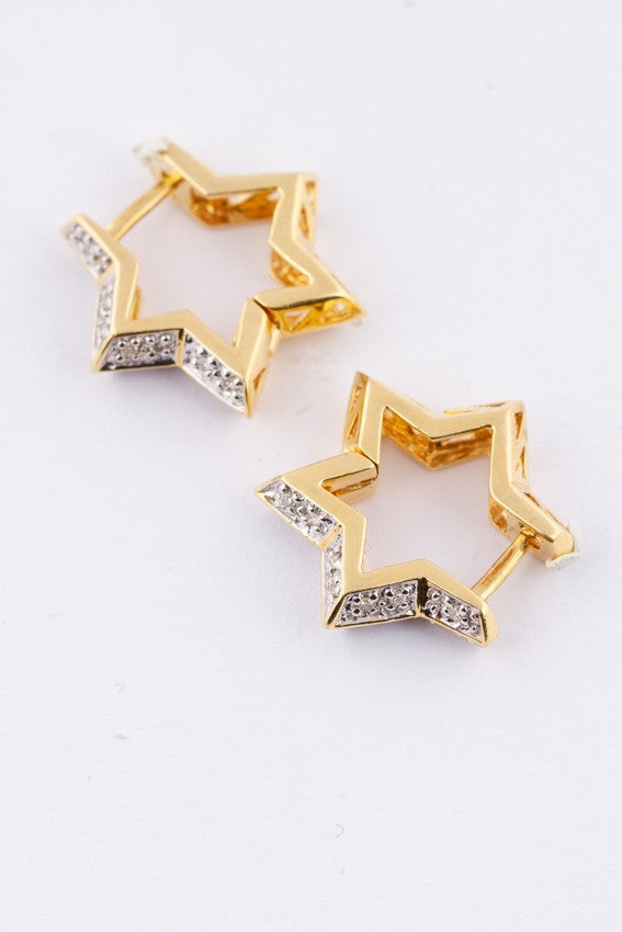 Gold star earrings with diamonds