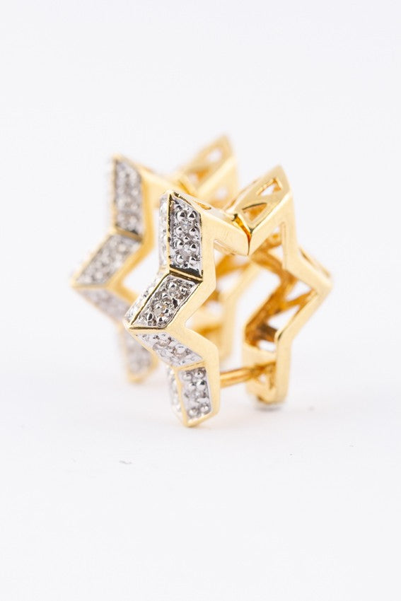Gold star earrings with diamonds