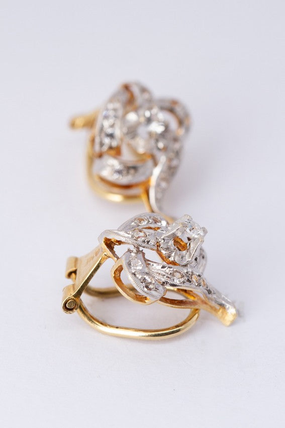 Gouden oorclips met witte spinel