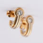 White/yellow gold stud earrings with a brilliant in each one