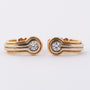 White/yellow gold stud earrings with a brilliant in each one