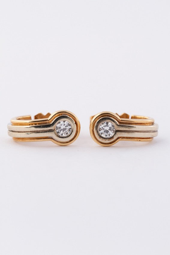 White/yellow gold stud earrings with a brilliant in each one