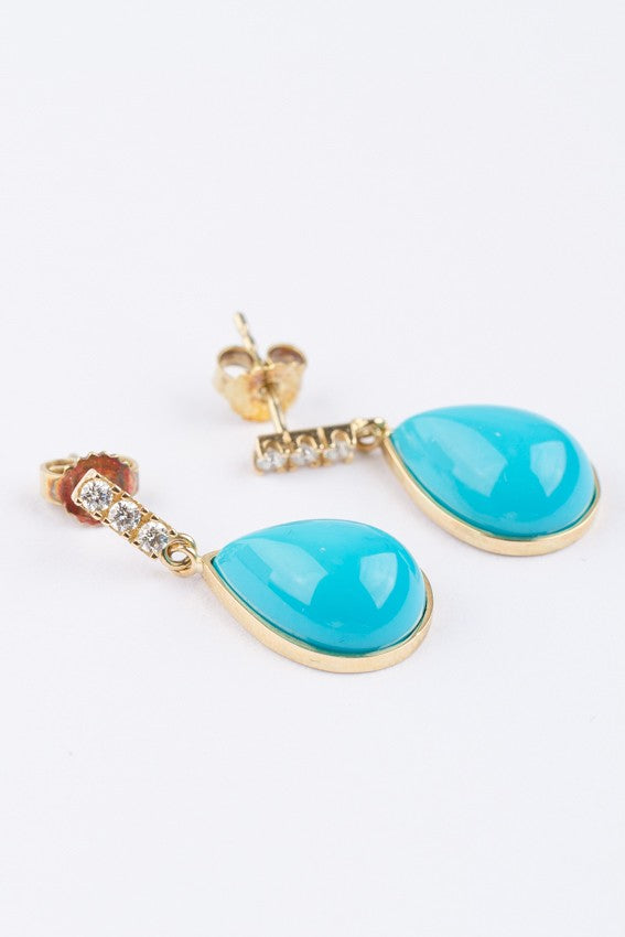 Gold earrings with a turquoise and 3 diamonds each