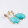 Gold earrings with a turquoise and 3 diamonds each