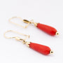 Gouden oorhangers met bloedkoraal