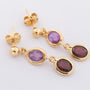 Gold earrings with various gemstones