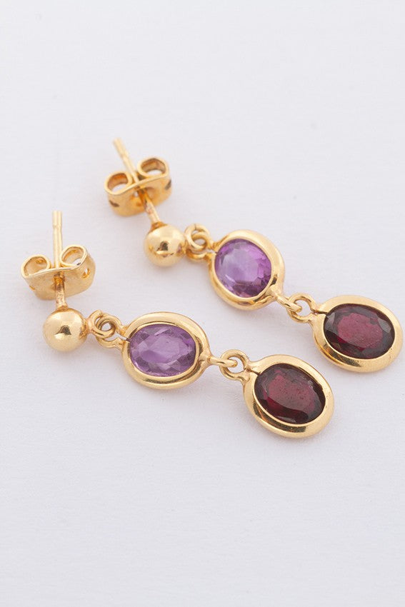 Gold earrings with various gemstones