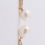Gold earrings with a pearl and diamonds