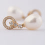 Gold earrings with a pearl and diamonds