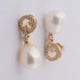 Gold earrings with a pearl and diamonds
