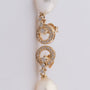 Gold earrings with a pearl and diamonds