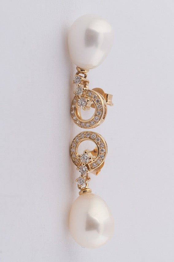 Gold earrings with a pearl and diamonds