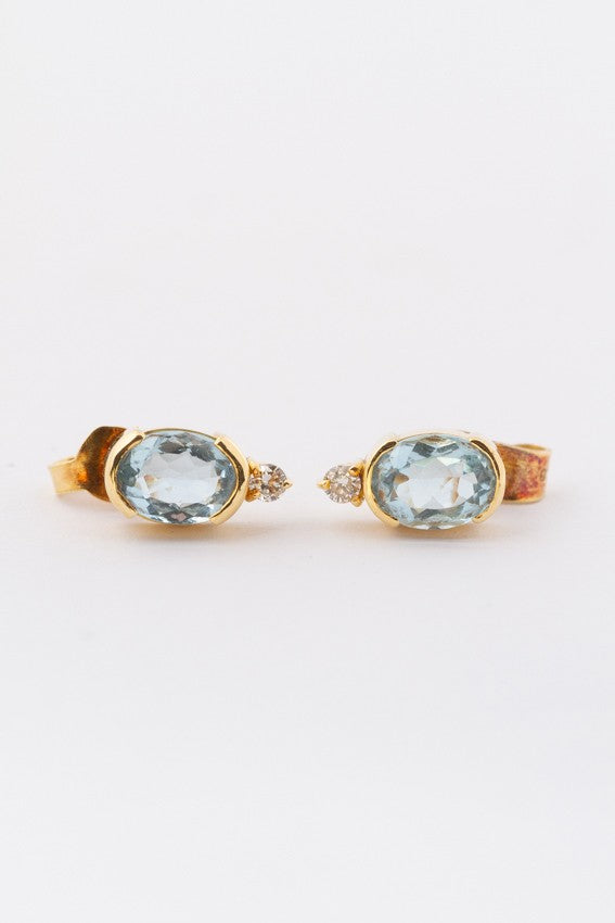 Gold earrings with an aquamarine and a brilliant each