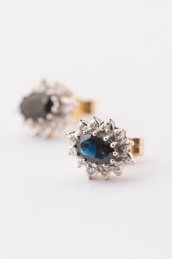 White/yellow gold earrings with a sapphire and 12 diamonds each