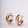 Gold trinity stud earrings from Cartier