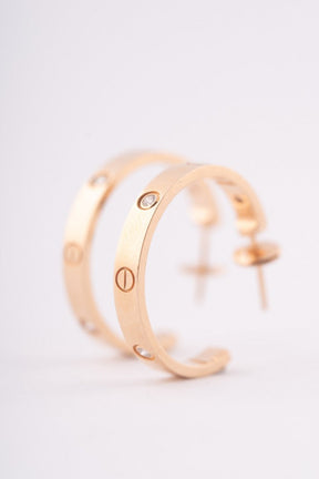 Cartier gold earrings with diamonds