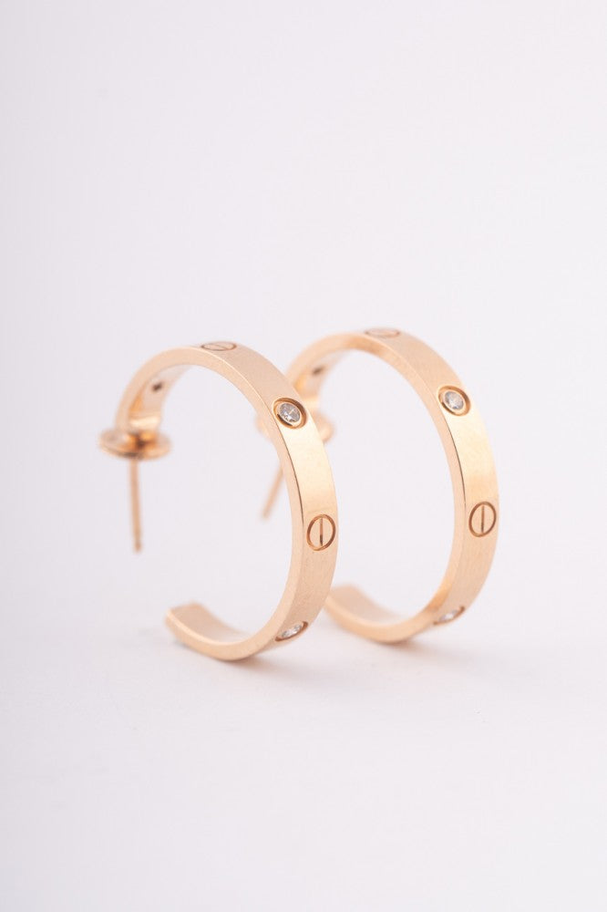 Cartier gold earrings with diamonds