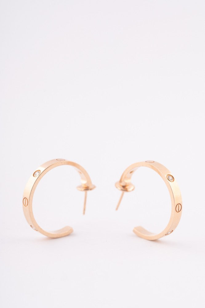 Cartier gold earrings with diamonds