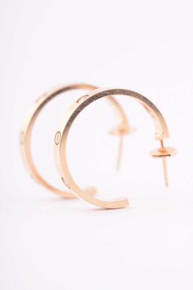 Cartier gold earrings with diamonds